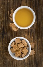 Caramel Sirup on a vintage background as detailed close-up shot (selective focus)