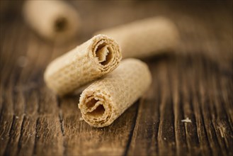 Wafers on an old wooden table as detailed close-up shot, selective focus