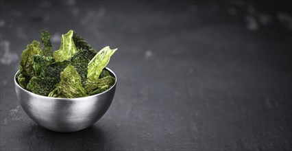 Some healthy Savoy Chips (selective focus, close-up shot)