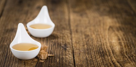 Caramel Sirup on a vintage background as detailed close-up shot (selective focus)