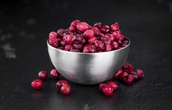 Portion of healthy Dried Cranberries (selective focus, close-up shot)