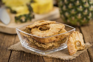 Some homemade Dried Pineapple Rings as detailed close-up shot, selective focus