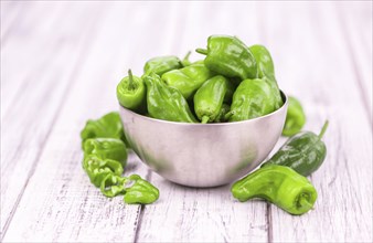 Raw Pimientos on a vintage background as detailed close-up shot, selective focus