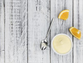 Fresh made Orange fruit Powder as detailed close-up shot (selective focus)