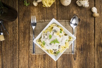 Porcini pasta on a vintage background as detailed close-up shot, selective focus