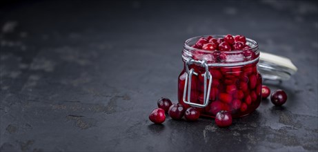 Portion of Preserved Cranberries as detailed close-up shot, selective focus