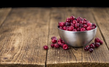 Portion of Dried Cranberries as detailed close-up shot, selective focus