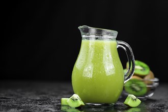 Fresh made Kiwi Smoothie (selective focus) on a vintage looking background