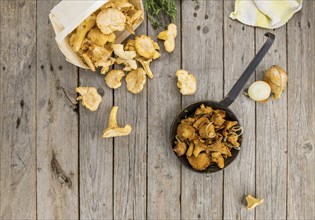 Fresh made Fried Chanterelles on a vintage background as detailed close-up shot