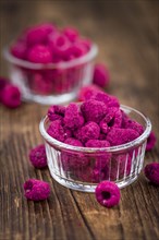 Dried Raspberries on a vintage background as detailed close-up shot, selective focus
