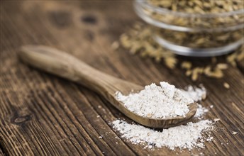 Portion of fresh Oat Flour on an old wooden table