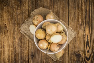 White Onions on a vintage background as detailed close-up shot, selective focus