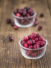 Portion of Dried Cranberries as detailed close-up shot, selective focus