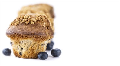 Blueberry Muffins isolated on white background (selective focus, close-up shot)