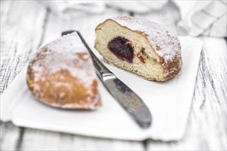 Portion of Berliner Doughnuts as detailed close-up shot, selective focus