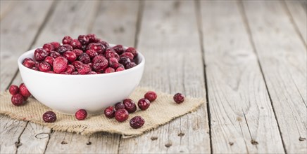 Portion of Dried Cranberries as detailed close-up shot, selective focus