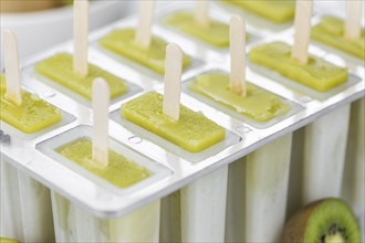 Kiwi Popsicles (fresh) as detailed close-up shot, selective focus)