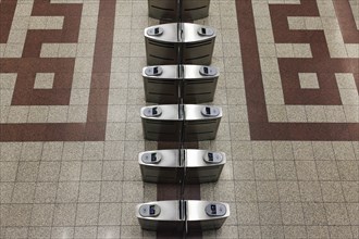 Row of modern ticket readers at Syntagma metro station, view from above, Athens, Greece, Europe