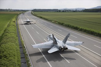 Swiss Air Force F/A 18 fighter aircraft take off and land on the A1 motorway during the Alpha Uno