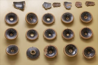 Pottery shards from the ancient court of shards, with the name Themistocles engraved on them, Agora