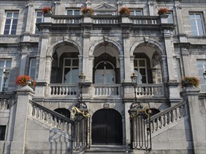 Historic building with arches and floral decoration on the staircase, classical architecture and