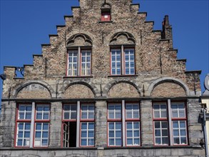 Historic building with gabled structure, brickwork and many windows, Bruges, Belgium, Europe