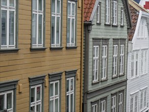 Old town with wooden facades and classic windows in different colours and styles, stavanger, norway