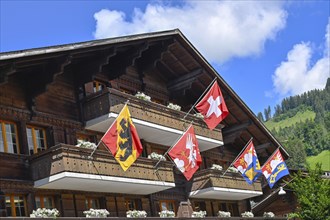 Roof with Bernese, Saanen and Swiss flags