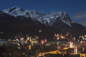 New Year's Eve fireworks over Garmisch-Partenkirchen, view of Alpspitze and Zugspitze, Wetterstein