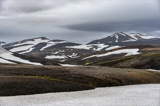 Volcanic landscape with hills and snow, Laugavegur trekking trail, Landmannalaugar, Fjallabak