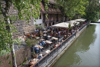 Well-attended garden pub on the Pegnitz, Nuremberg, Middle Franconia, Bavaria, Germany, Europe