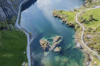 Aerial view of islands in lake Lovatnet (or: Loenvatnet), roads along the lake, valley Lodalen