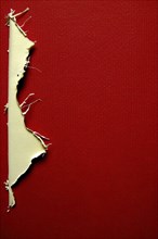 Abstract minimalist image of a red background with a strip of peeling paint, AI generated