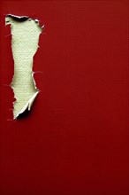 A strip of ripped paper revealing a textured surface against a red background, AI generated