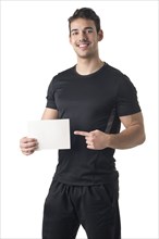 Male Personal Trainer Holding an Empty Card, isolated in white