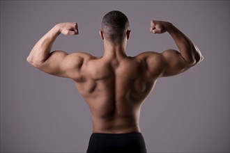 Bodybuilder doing a Back Double Biceps pose