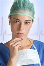 Young female surgeon with scrubs, thinking, with an EKG graph behing her