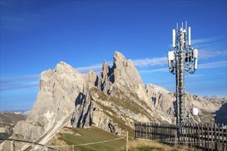 Mobile phone mast on the Seceda in front of the Geisler peaks, Val Gardena, South Tyrol