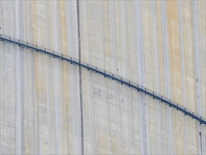 Barrage de Mauvoisin, detail of the concrete dam, steel construction along the dam, Switzerland,