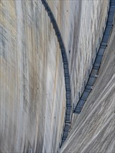 Barrage de Mauvoisin, detail of the concrete dam, steel construction along the dam, Switzerland,