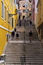 People walking on stairs, Old Town, Lisbon, Portugal, Europe