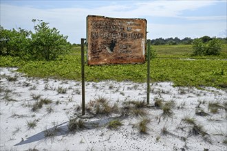 Rusted sign at the entrance to Loango National Park, Parc National de Loango, Ogooué-Maritime