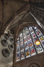 Old stained-glass window, on the right a funerary plaque in a side altar, St.Lorenz, Nuremberg,