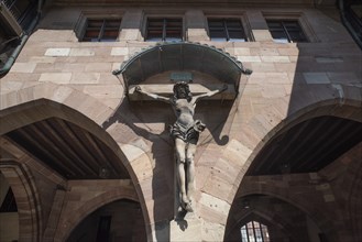 Crucifix in the inner courtyard of the historic Heilig-Geist-Spital, Nuremberg, Middle Franconia,