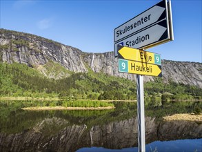 Norwegian road signs in the direction of Evje and Haukeli, at village Valle, river Otra, Setesdal