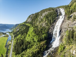 Aerial view of waterfall Reiarsfoss at lake Bygdlandsfjord, Setesdal valley, Norway, Europe