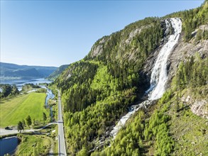 Aerial view of waterfall Reiarsfoss at lake Bygdlandsfjord, Setesdal valley, Norway, Europe