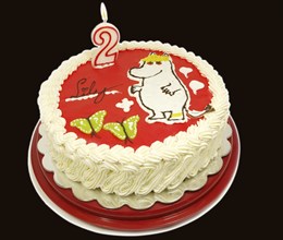 The Snork Maiden moomin, onto a cream cake, candle of number 2 with flame