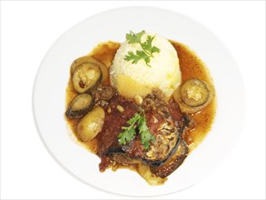 Eggplant dish, fried vegetables in juicy sauce, next to bowl of rice