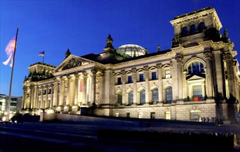 German reichstag building at night with dark blue sky
